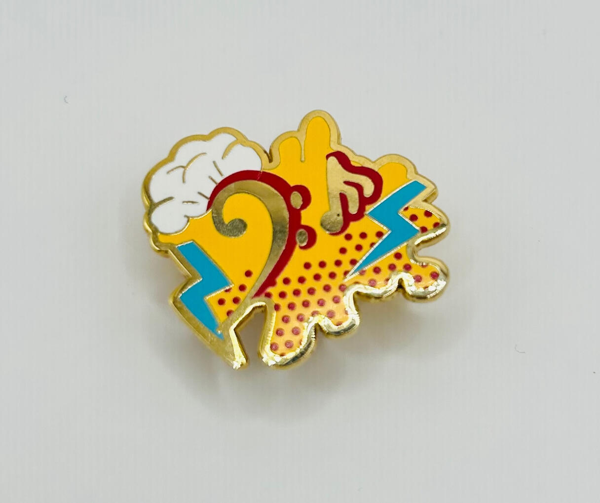 Bass clef pin with clouds and lightning for music rewards and achievements.
